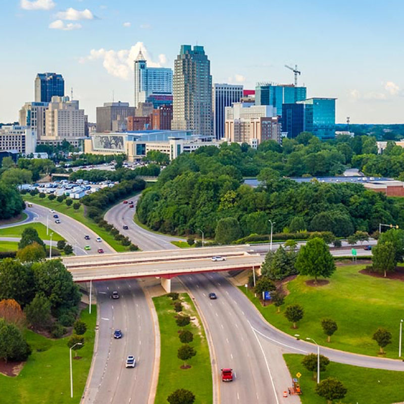 The Raleigh skyline and HWY 64