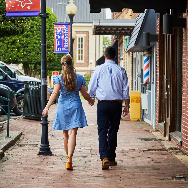 couple window shops in historic Pittsboro